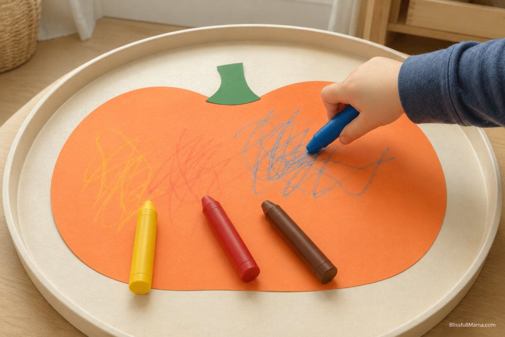 Low-mess paper pumpkin craft using chunky toddler crayons